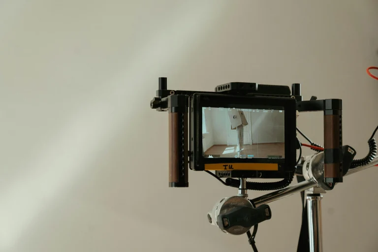 Close-up of a video monitor capturing a creative scene on a film set representing behind-the-scenes content creation