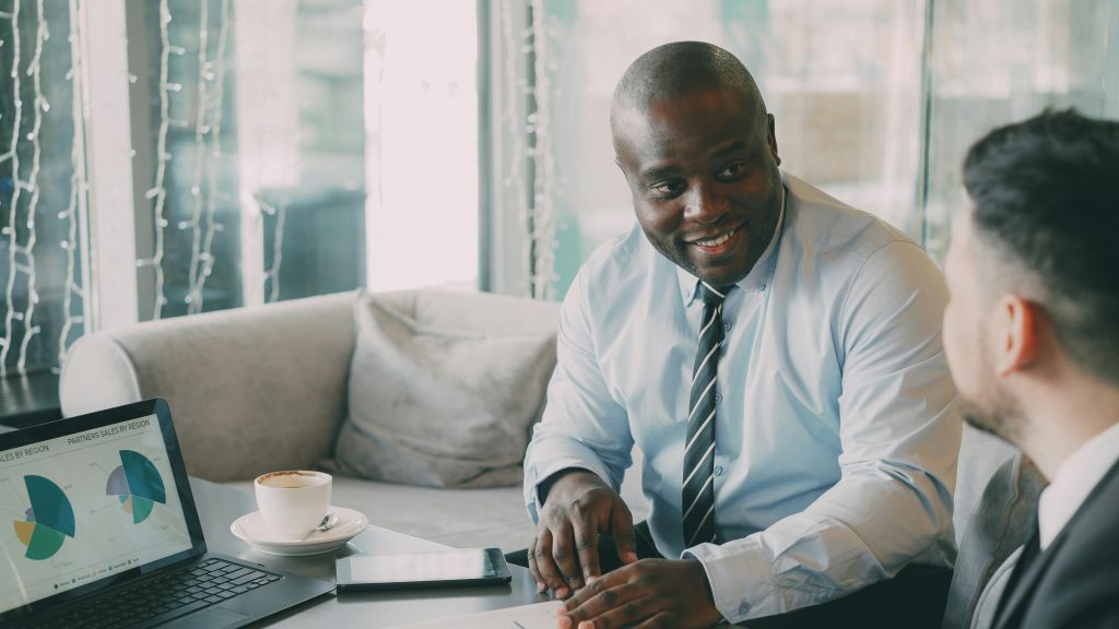 Entrepreneurs discussing business growth and digital product strategy