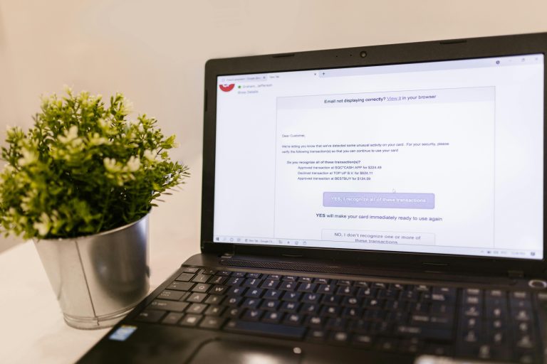 Laptop showing email automation dashboard for digital product sellers