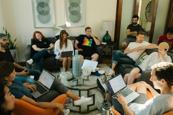 Distributed agency team collaborating in a home office environment using time tracking software