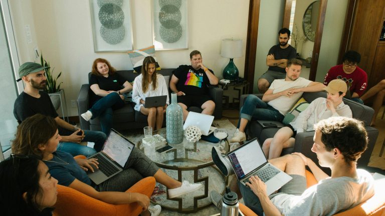 Distributed agency team collaborating in a home office environment using time tracking software
