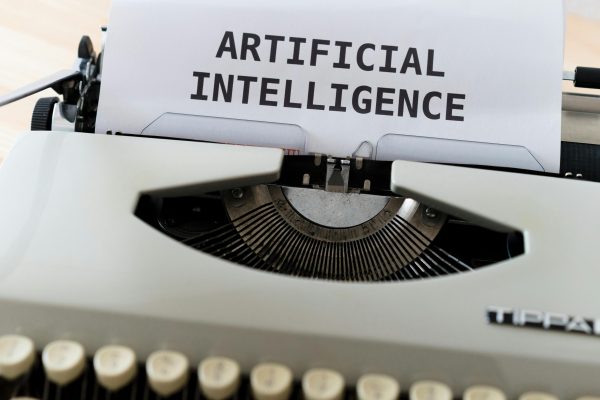 Typewriter showing artificial intelligence text representing AI content detection